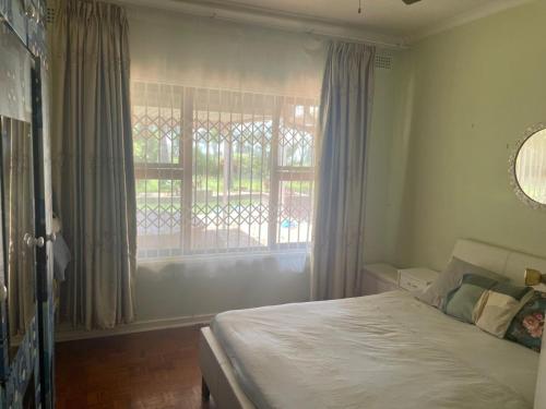 En eller flere senge i et værelse på Tedford House