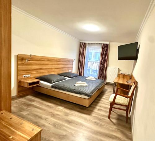 Postel nebo postele na pokoji v ubytování Hotel Kennedy