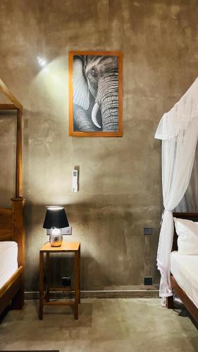 Postel nebo postele na pokoji v ubytování Villa Bell Rose Hikkaduwa
