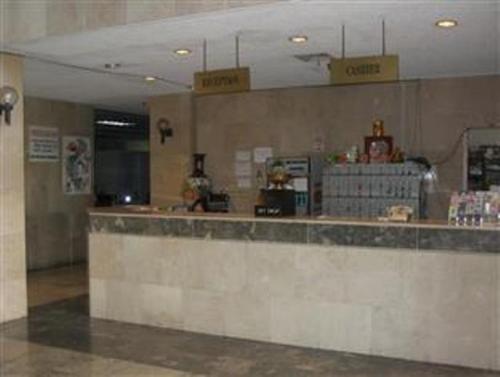a restaurant with a counter and a unintention at Tumon Bay Capital Hotel in Tumon