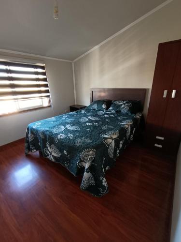 En eller flere senge i et værelse på ICARUMBI