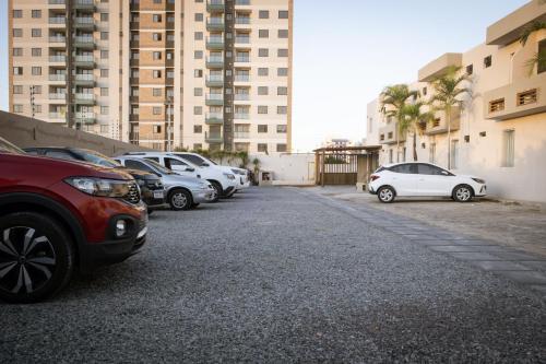 a row of cars parked in a parking lot at Marezzi Hotel Aracaju in Aracaju