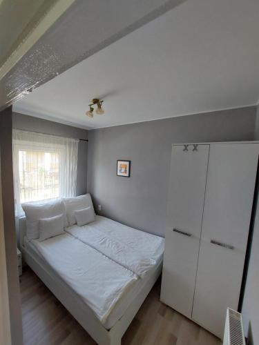 Postel nebo postele na pokoji v ubytování Csalogány 19 Apartman