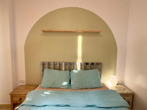 a bedroom with a bed with an arch above it at Ocean Life Dahab in Dahab