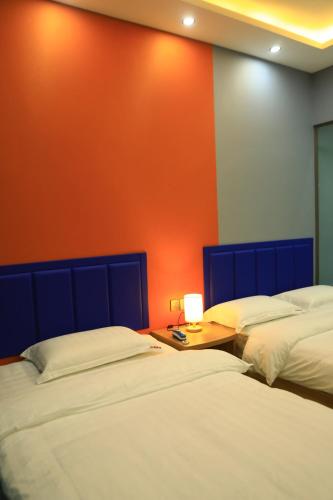Cama o camas de una habitación en Hongge Hotel - Harbin Taiping Airport