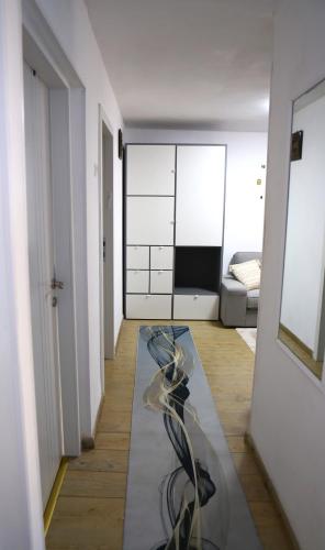 a room with a glass table in the middle of a room at Sweet Home in Dimona