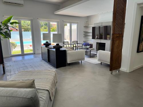 a living room with a view of the ocean at Estoril 17 in Estoril