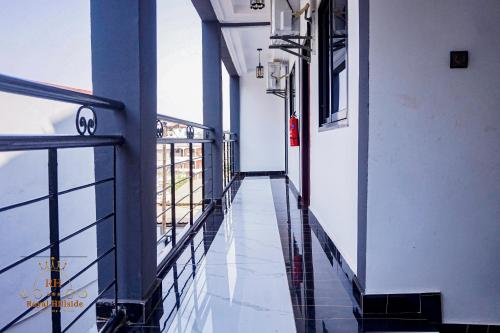an empty corridor of a building with a glass floor at Royal Hillside Apartments and Hotels in Yaoundé