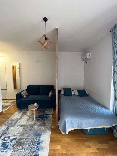 Säng eller sängar i ett rum på G4 Apartment