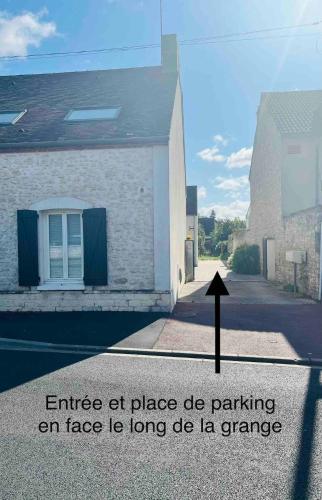 an image of a building with a sign on a street at Chez Hélène et Jérémy in Montargis