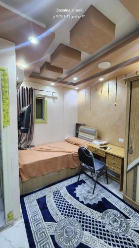 Ένα ή περισσότερα κρεβάτια σε δωμάτιο στο استديوهات للايجار في اكتوبر الحي الاول مجاورة تامنه أرضي مرتفع