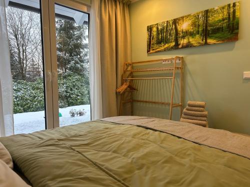 Ένα ή περισσότερα κρεβάτια σε δωμάτιο στο Ferienhaus Waldsiedlung