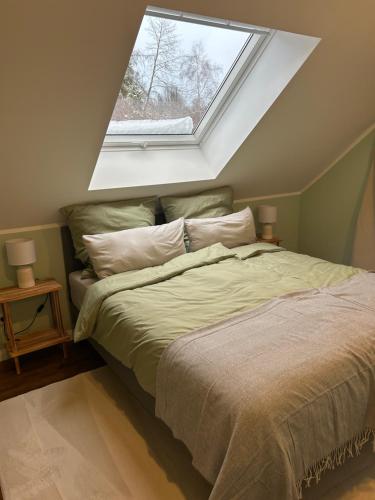 Postel nebo postele na pokoji v ubytování Ferienhaus Waldsiedlung