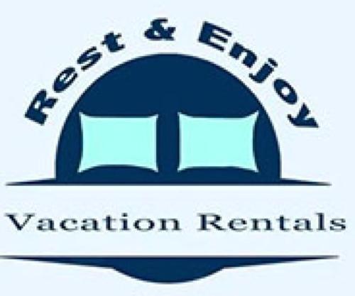a logo for an education center with an open book at Summer Bliss 3BR Home, Walk to Beach Master Suite Sleeps 9 in Galveston