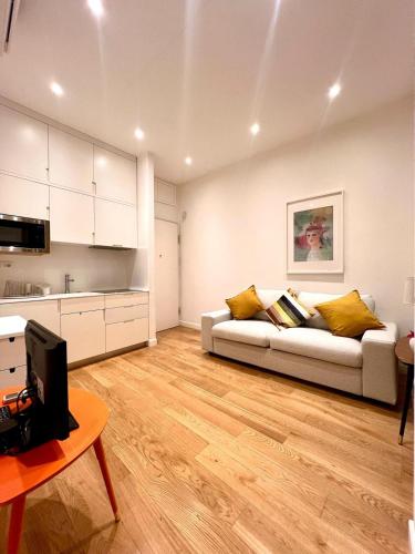 a living room with a couch and a table at Via Del Corso Home Roma in Rome