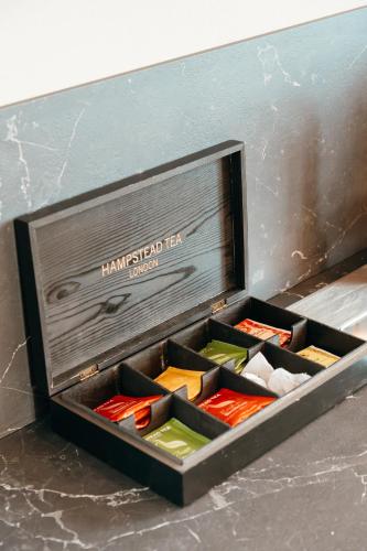 a wooden box filled with different types of knives at Wine & Wellness in Villalta