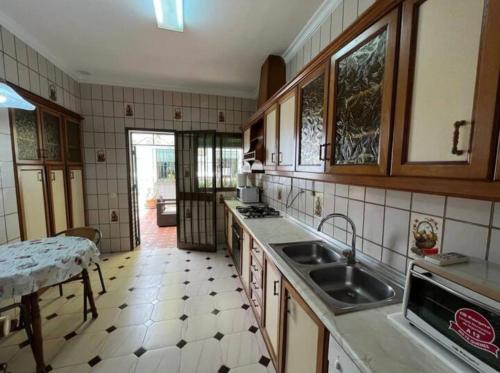 a kitchen with a sink and a counter top at Alma de Estepona junto al mar in Estepona