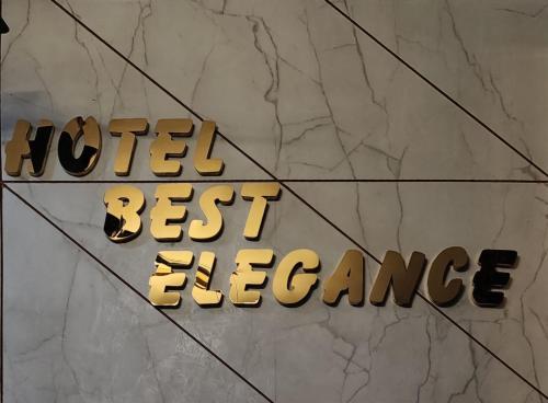 a sign that reads hotel best best experience at Hotel Best Elegence in Gandhinagar