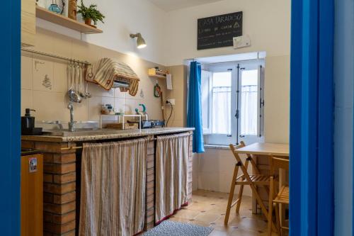 a kitchen with a sink and a counter top at Casa Paradiso in Castronuovo di Sicilia