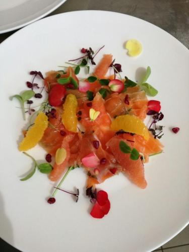 a white plate of food with vegetables on it at La Corte Nascosta Volpedo in Volpedo