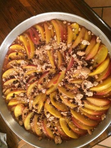 a pan filled with apple slices and nuts at La Corte Nascosta Volpedo in Volpedo
