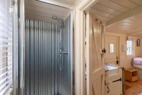 a bathroom with a shower and a sink at Walltree House in Brackley