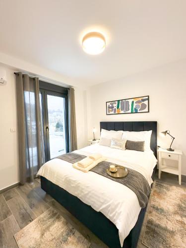 Ένα ή περισσότερα κρεβάτια σε δωμάτιο στο ORDO Apartments