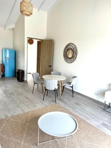 a living room with a table and chairs at New villa Caribbean Pearl in Willemstad