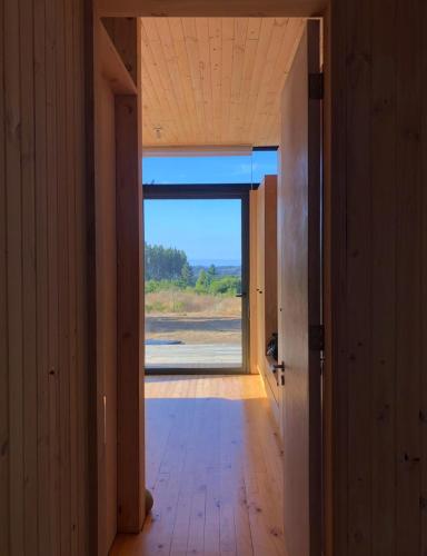 an open hallway with a door to a room with a view at Casa Puertecillo in Puertecillo