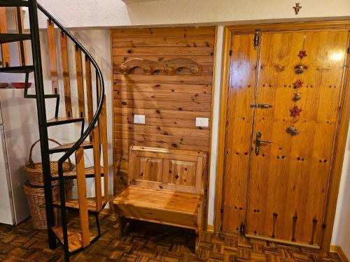 a wooden room with a staircase and a wooden door at Erbanova in Sila in Camigliatello Silano