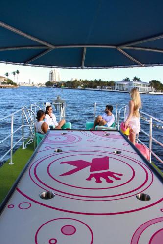 a group of people on a boat in the water at Lux House Heated Spa & Free Boat Tour! in Fort Lauderdale
