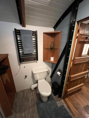 a small bathroom with a toilet in a house at The carriage in Three Cocks Junction