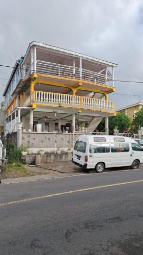 a white van parked in front of a building at Valo's 360 Services in Portsmouth