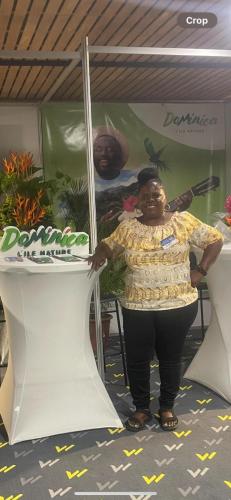 a woman is standing in front of a table at Valo's 360 Services in Portsmouth