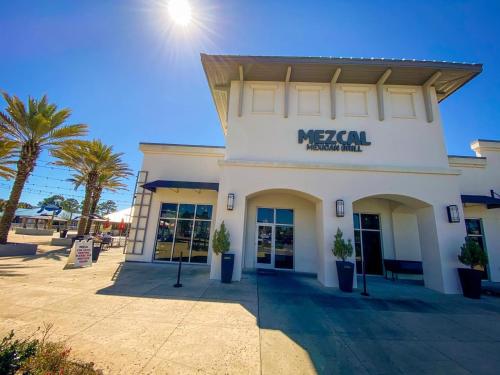 a mobil building with palm trees in front of it at Ariel Dunes 209 in Coffeyville