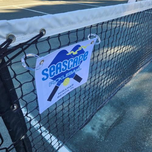 a sign is attached to a tennis net at Ariel Dunes 209 in Coffeyville
