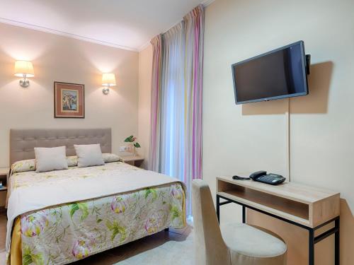 TV a/nebo společenská místnost v ubytování Hostal Antigua Morellana