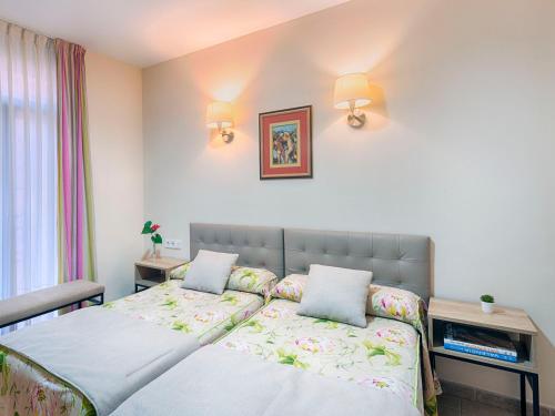 Postel nebo postele na pokoji v ubytování Hostal Antigua Morellana