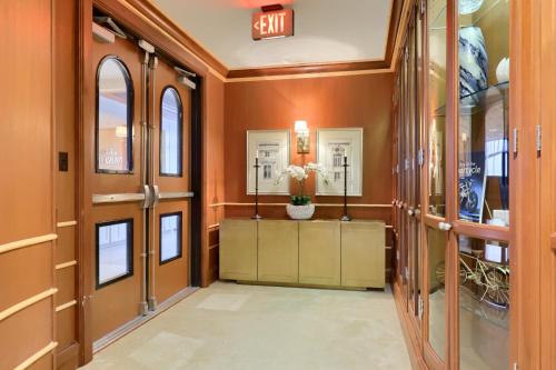 a hallway with an exit sign on the wall at The Executive Suites and Events in Ephrata