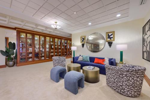 a living room with a blue couch and chairs at The Executive Suites and Events in Ephrata