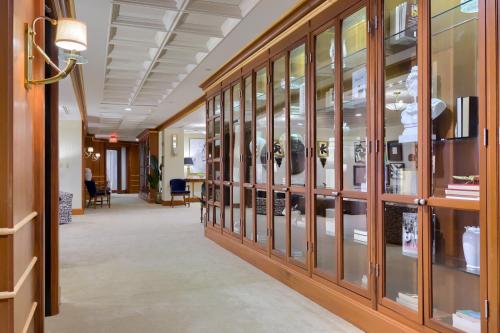 a hallway in a building with glass cases at The Executive Suites and Events in Ephrata