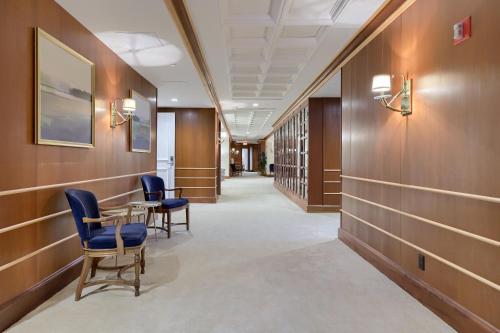 a hallway with chairs and a table in a building at The Executive Suites and Events in Ephrata