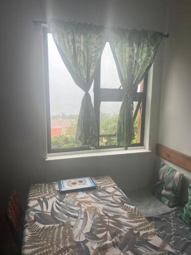 Katil atau katil-katil dalam bilik di Laidback holiday home