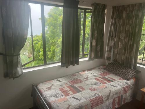 Katil atau katil-katil dalam bilik di Laidback holiday home