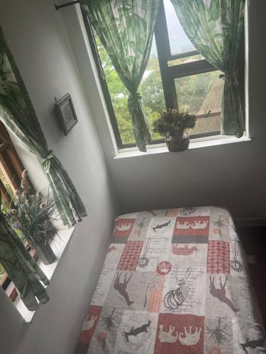 Katil atau katil-katil dalam bilik di Laidback holiday home