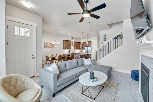 a living room with a couch and a ceiling fan at Lovely Townhome at the TPC Golf Course in Berthoud
