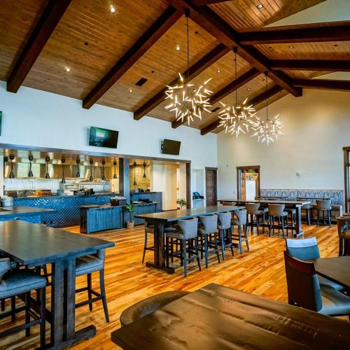 a large dining room with tables and chairs at Lovely Townhome at the TPC Golf Course in Berthoud