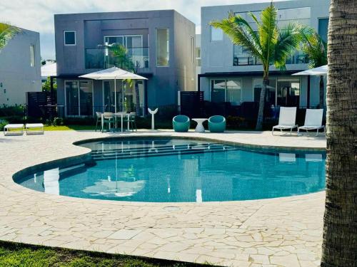 a large swimming pool in front of a building at Beach Home at Playa Caracol in Chame
