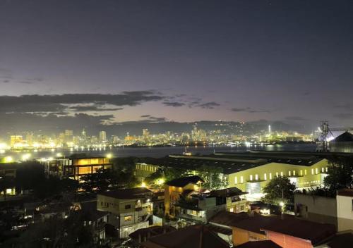 a view of a city at night at Shiloh Suites at Saekyung 956 in Lo-oc