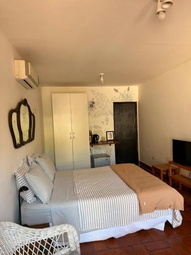 Ένα ή περισσότερα κρεβάτια σε δωμάτιο στο El cuartito Iguazu